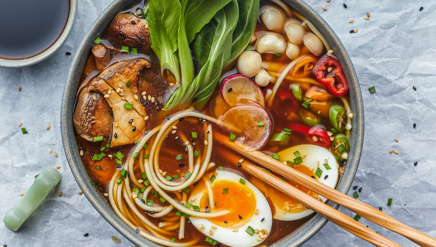 Bowl of Ramen made with custom beef base and mushroom flavor concentrate. Enhanced with fresh onion, leek, peppers and hard-boiled egg.